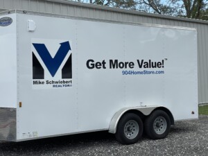 Realtor with moving truck trailer in orange park.