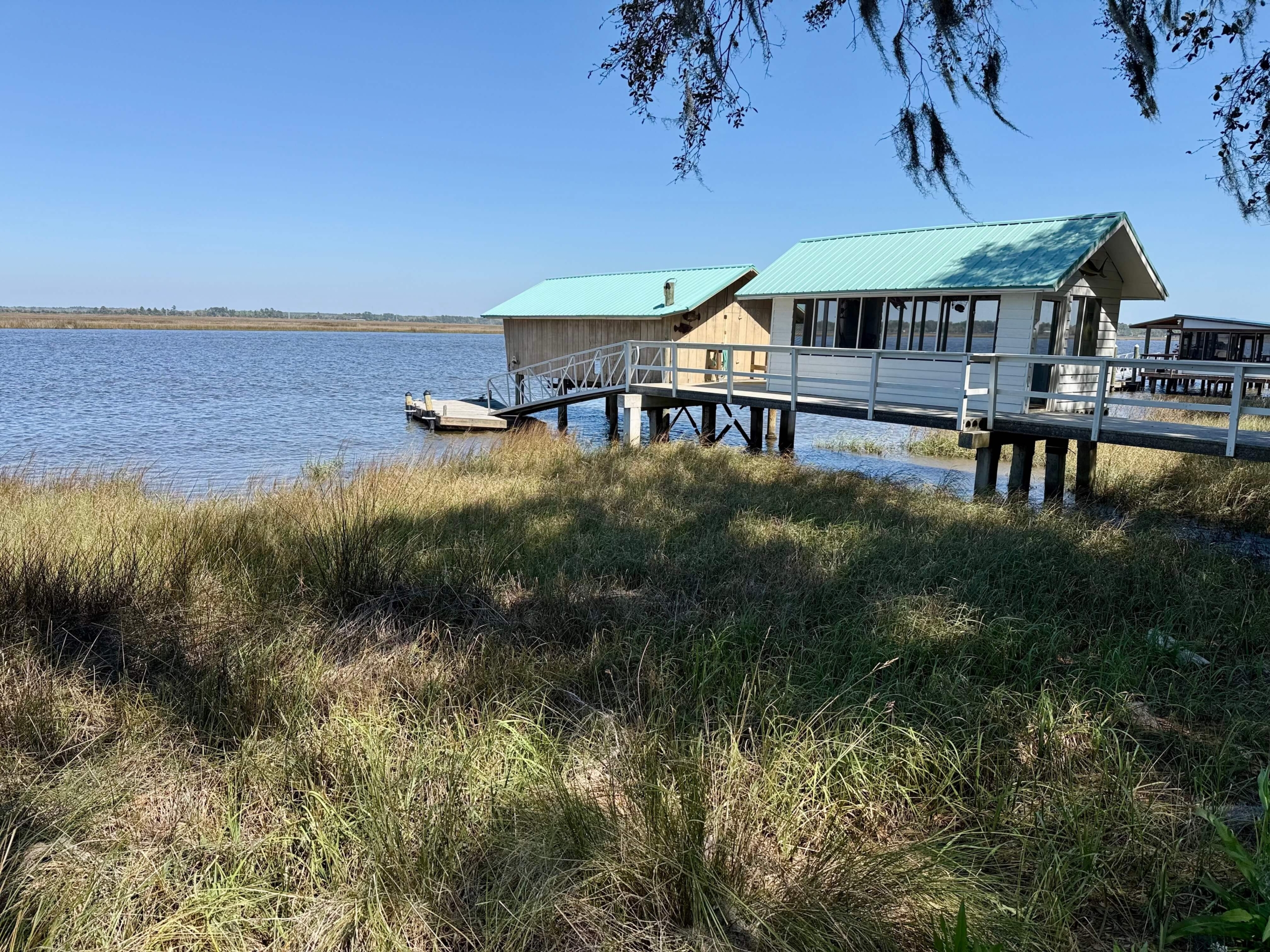 photo of the boat house on the river