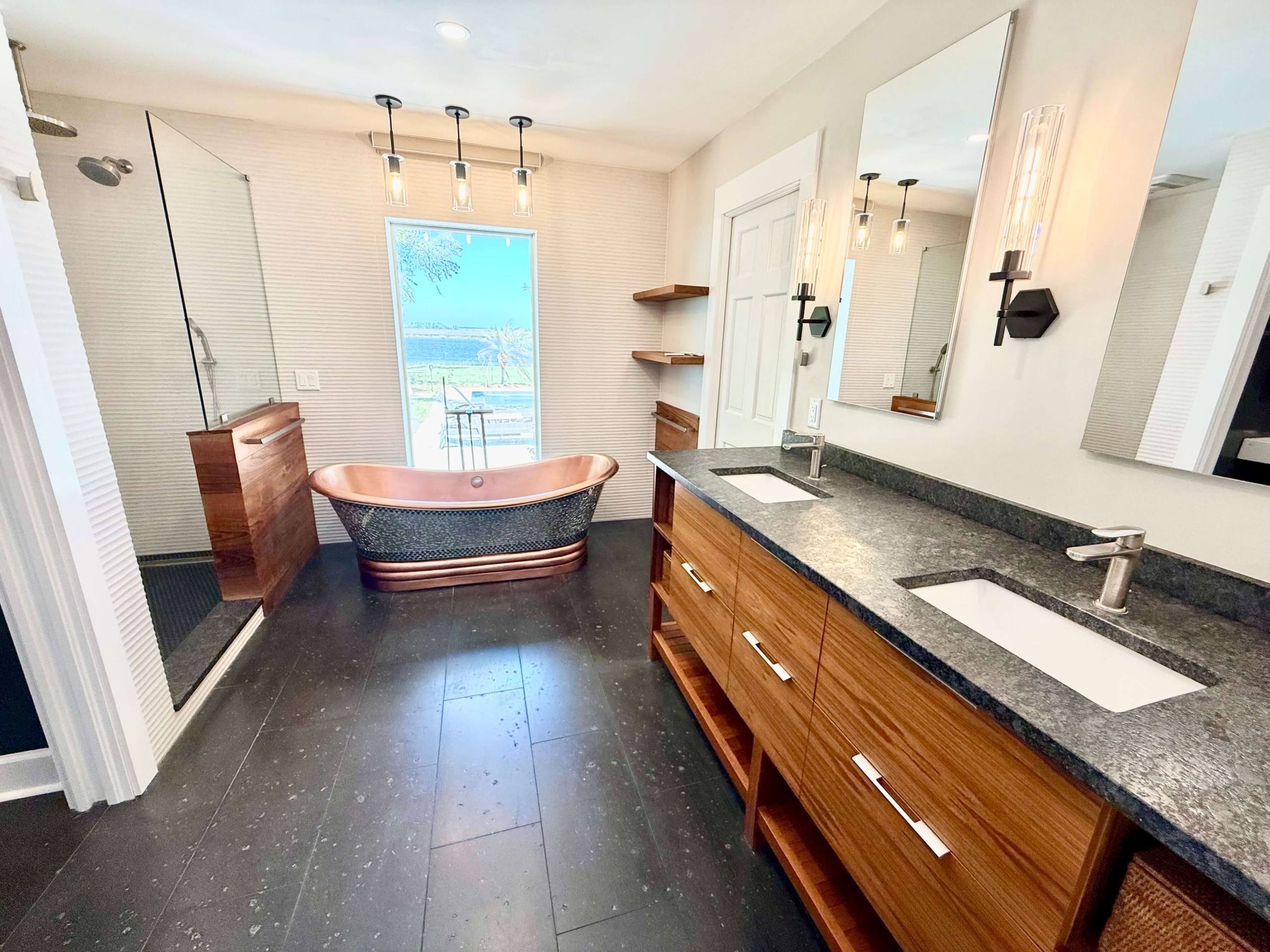 Photo of bathroom with copper tub and two sinks