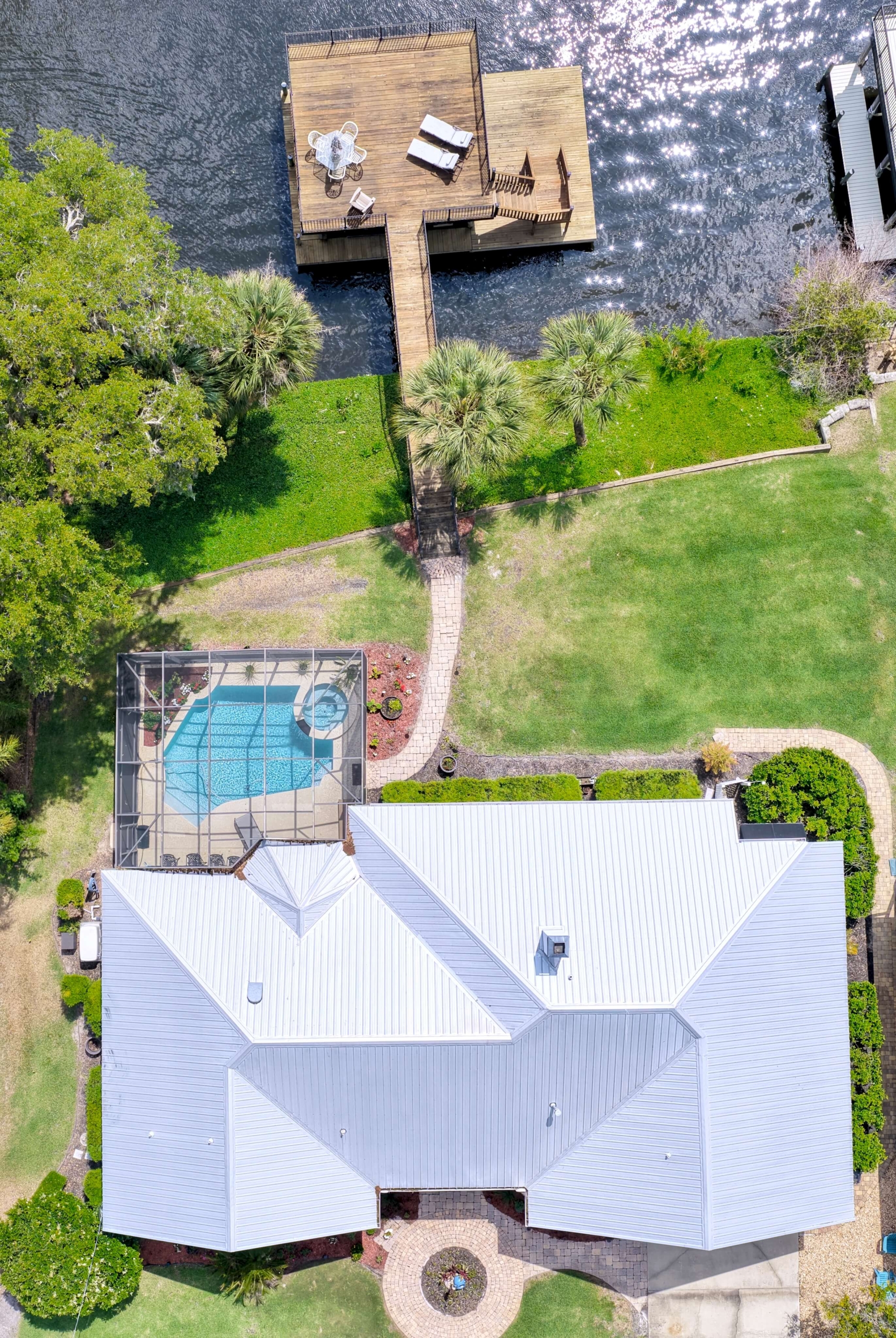 Overhead Photo of Pool Home That is Riverfront in Satsuma Florida with Metal Roof